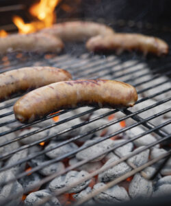 Brats on a charcoal grill