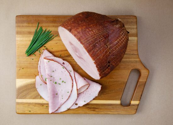 sliced ham on a cutting board